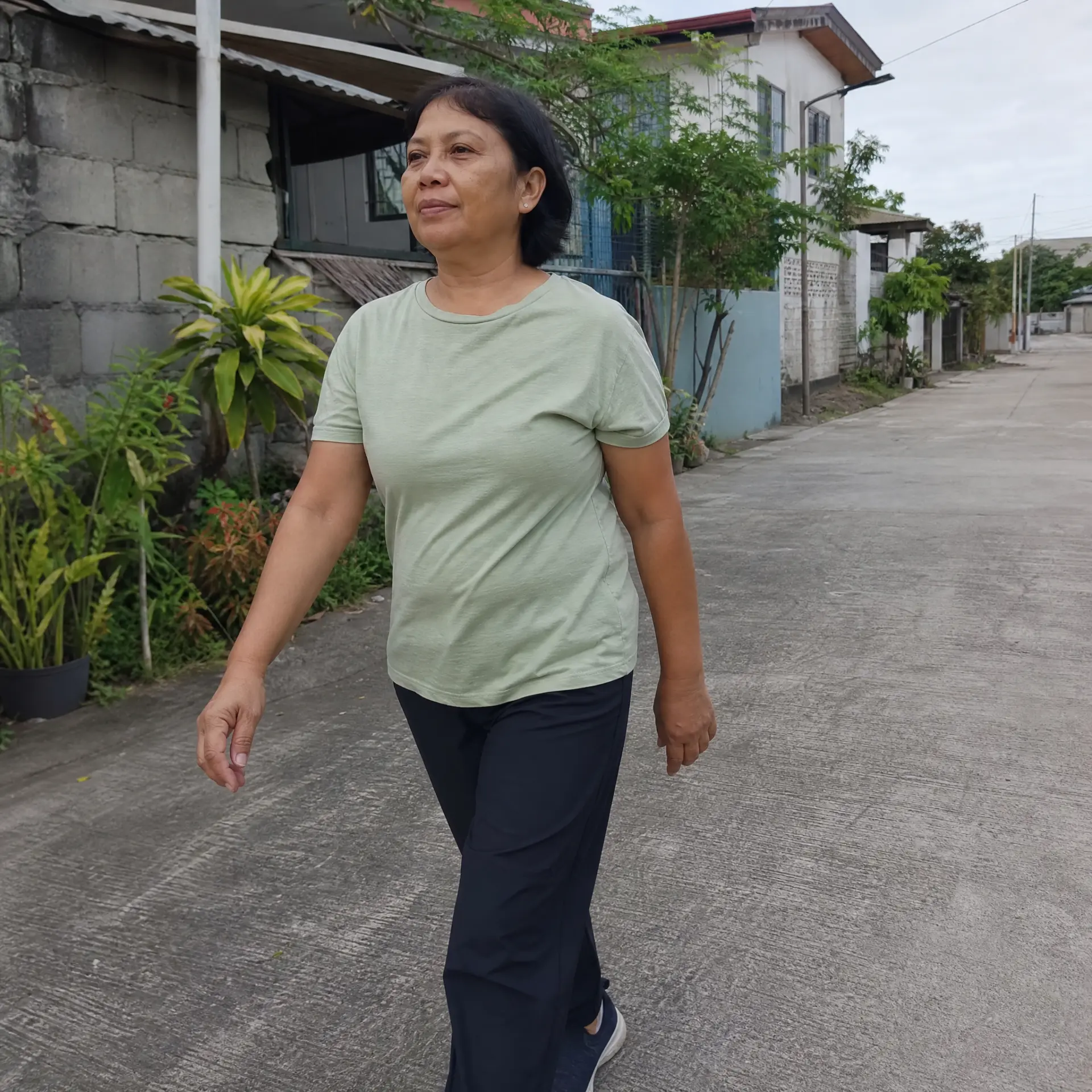 Filipino woman over 45 taking a relaxed morning walk