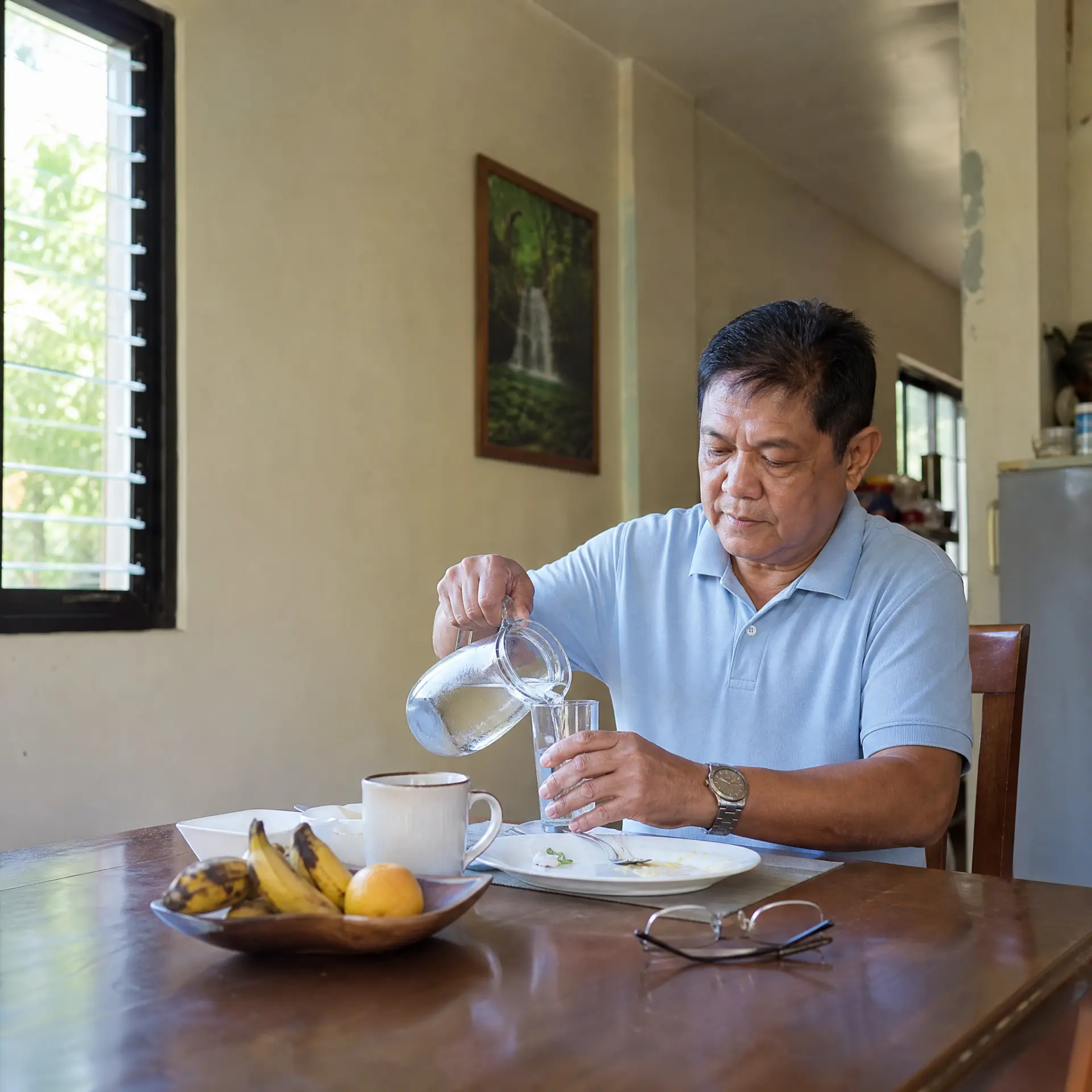 Filipino man following a simple morning wellness routine at home